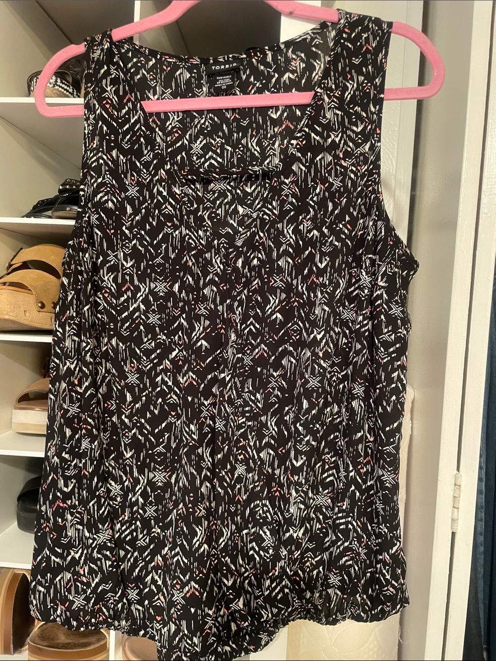 Torrid’s Black Geometric Print Sleeveless Tank with White & Red Accents